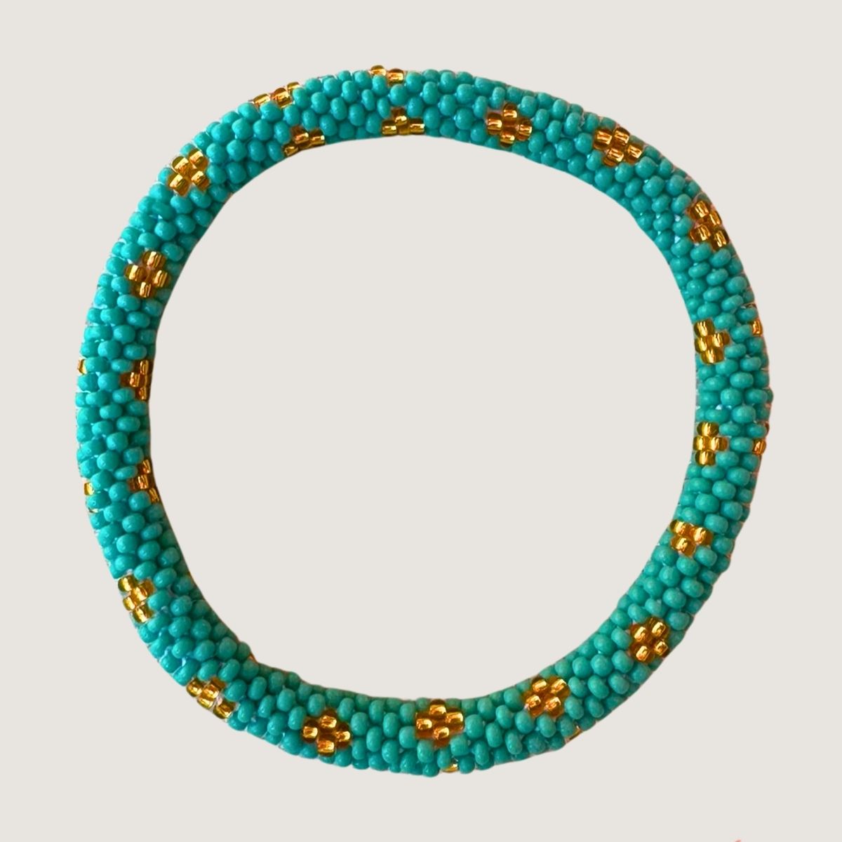 Turquoise à pois doré